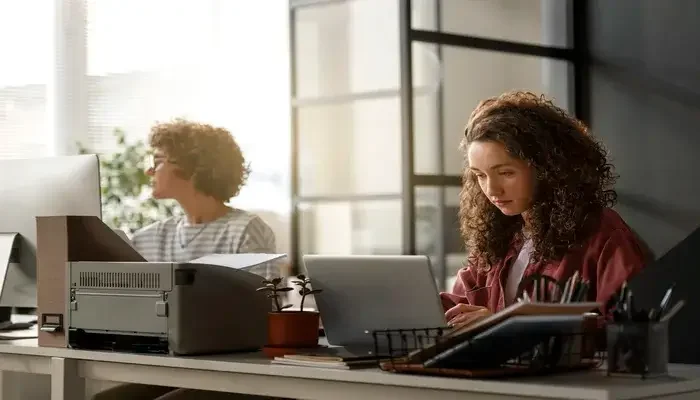 medium shot women working desk